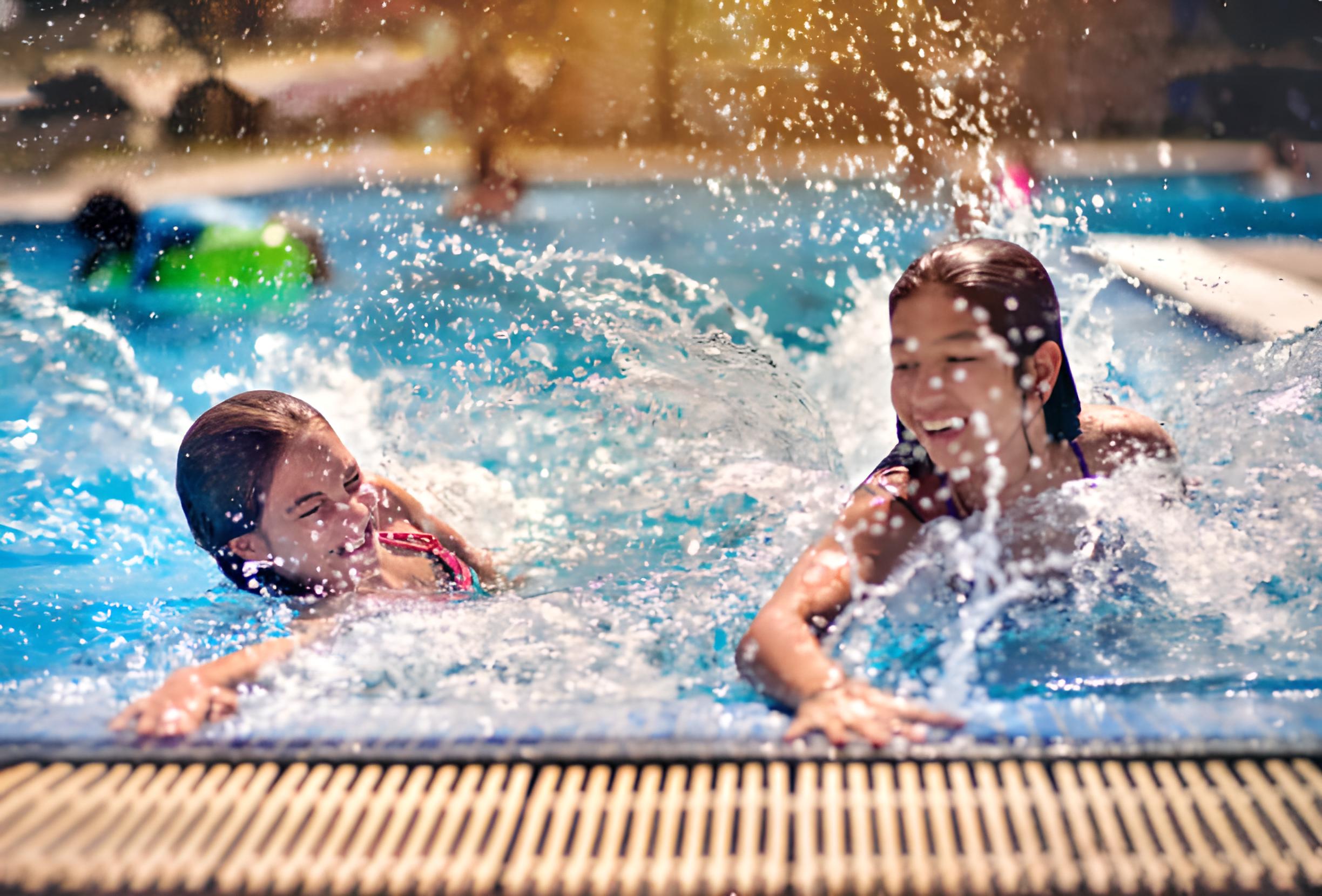 Children enjoying swimming lessons at AQUA S.T.A.R. Canada